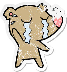 distressed sticker of a cartoon crying bear