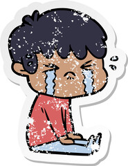 distressed sticker of a cartoon boy crying