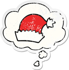 cartoon christmas hat with thought bubble as a distressed worn sticker