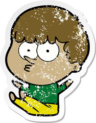 distressed sticker of a cartoon boy sat waiting