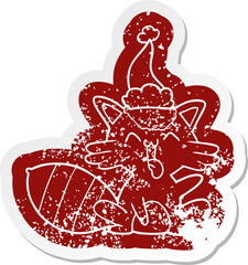 cute quirky cartoon distressed sticker of a raccoon wearing santa hat