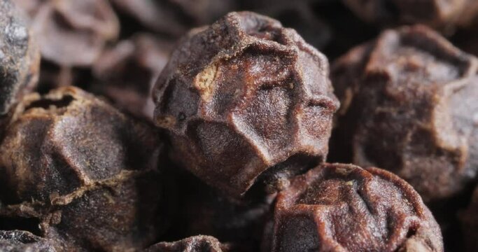 Peppercorns or black pepper spice. Super Macro Close Up.