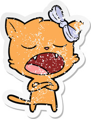 distressed sticker of a cartoon yawning cat