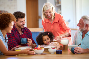 Multi-Generation Family At Home Enjoying Breakfast Together