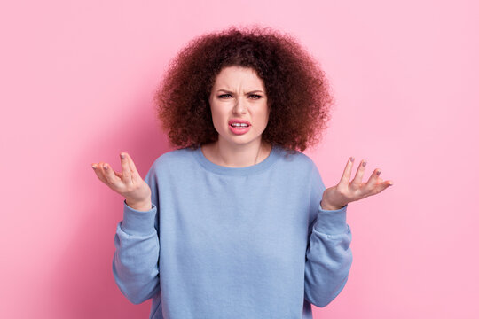 Photo of angry upset lady dressed blue pullover rising arms asking understand her isolated pink color background