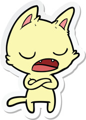 sticker of a talking cat with crossed arms