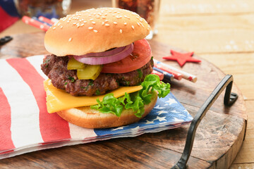 4th of July American Independence Day traditional picnic food. American Burger and cocktail, American flags and symbols of USA Patriotic picnic holiday on white wooden background. Top view