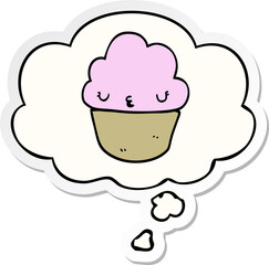 cartoon cupcake with face with thought bubble as a printed sticker