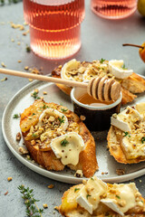 toasts croutons with cheese camembert and pear, honey, walnut, banner, menu, recipe place for text, top view
