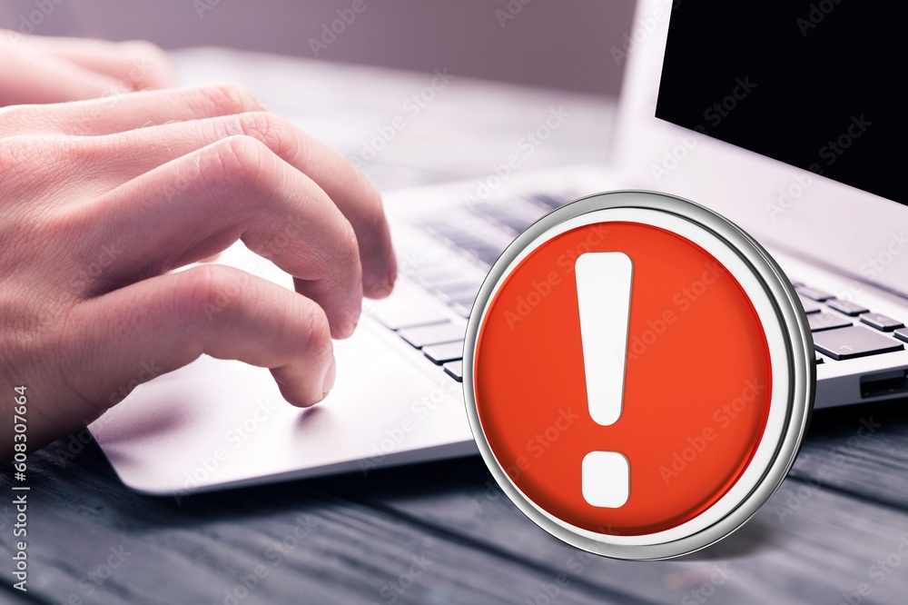 Poster warning red sign on table with computer