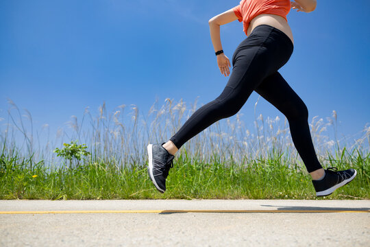A pregnant woman is doing jogging exercise for health