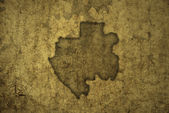 map of gabon on a old vintage crack paper background .