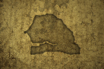 map of senegal on a old vintage crack paper background .