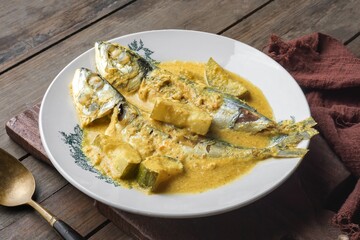 The popular dish is known as Ikan Kembong Masak Lemak Cili Api with Cucumber. The main ingredients are chilies and coconut milk. Suitable to eat during lunch or dinner.