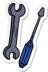 hand drawn sticker cartoon doodle of a spanner and a screwdriver