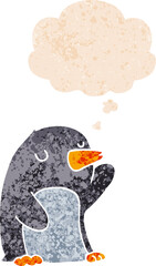 cartoon penguin with thought bubble in grunge distressed retro textured style