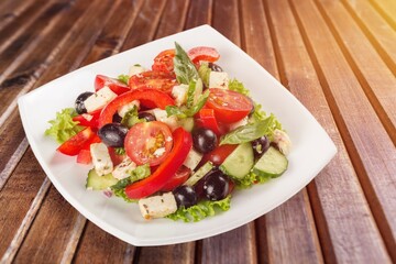 Plate of fresh tasty salad with cheese