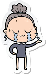 sticker of a cartoon crying old lady