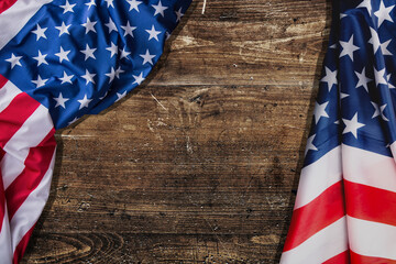 USA flag folded on wooden table background. American flag top view, copy space. Memorial day and 4th of July, Independence day mock up, template.