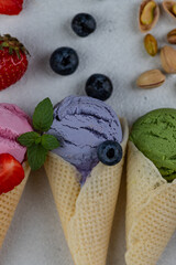 Colorful ice cream in waffle cones