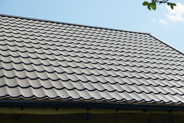 The roof of metal.Corrugated metal roof and metal roofing. Modern roof made of met.