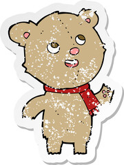 retro distressed sticker of a cartoon teddy bear wearing scarf