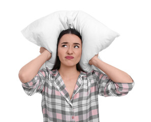 Tired young woman covering ears with pillow on white background. Insomnia problem