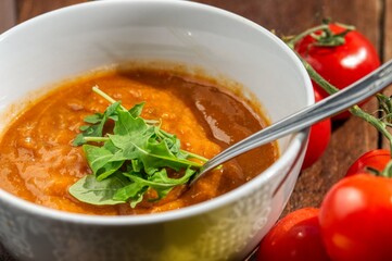 country vegetable soup in a bowl on a wooden table