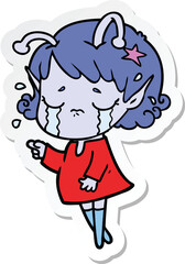 sticker of a cartoon crying alien girl