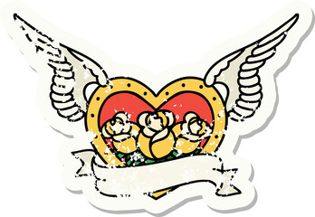 distressed sticker tattoo in traditional style of a flying heart with flowers and banner