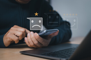 Concepts, bad experiences, or bad service and dissatisfied customers. Rating the dissatisfied man with the sad face icon and rating one star with the application on smart phones
