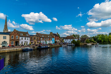 A view towards the quayside of the River Great Ouse at St Ives, Cambridgeshire in summertime