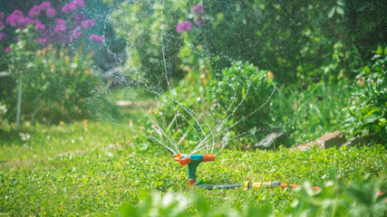 Landscape automatic garden watering system with different rotating sprinklers