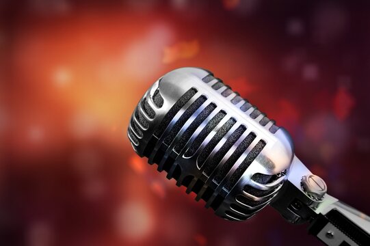 Professional microphone on dark background with lights