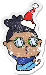hand drawn distressed sticker cartoon of a woman wearing spectacles wearing santa hat