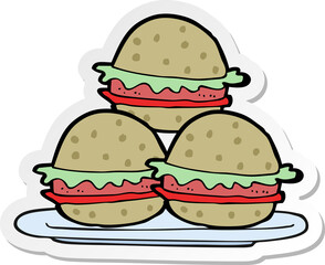sticker of a cartoon plate of burgers