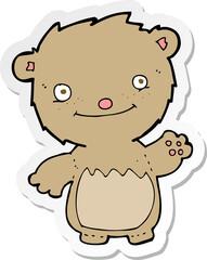 sticker of a cartoon waving teddy bear