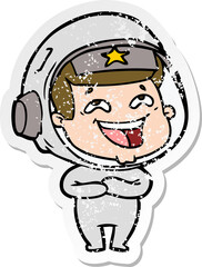 distressed sticker of a cartoon laughing astronaut