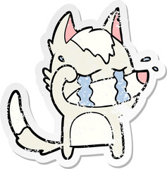 distressed sticker of a cartoon crying wolf rubbing eyes