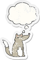cartoon wolf with thought bubble as a distressed worn sticker