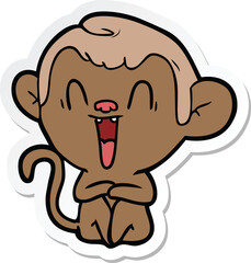 sticker of a cartoon laughing monkey