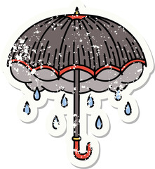 distressed sticker tattoo in traditional style of an umbrella and storm cloud
