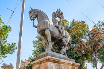 Barcelona, Spain - November 26, 2021: Equestrian statue of Barcelona by Frederic Mares in Barcelona, 1928. Sculpture of a woman sitting on a horse and holding a ship in her hands on Placa de Catalunya - obrazy, fototapety, plakaty