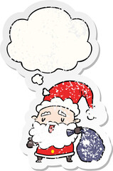cartoon santa claus with sack with thought bubble as a distressed worn sticker