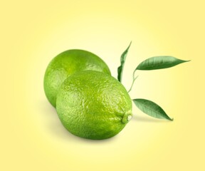Green fresh lime fruit on background