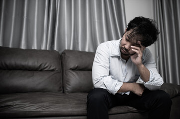 Fototapeta na wymiar Asian handsome man stress from work overload,Tired male come back home after a lot of work from company,risk of depression