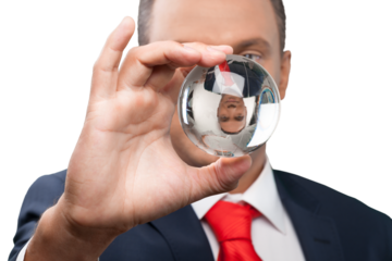 Close-up of young business man holding glass globe