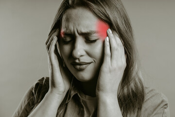 Pretty woman is suffered headache. Migraine, massages temples, magnetic storms