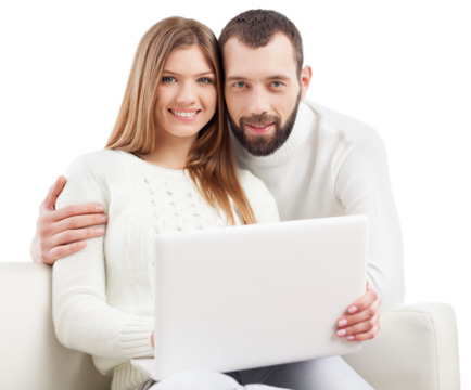 Portrait of a happy young couple using laptop on sofa