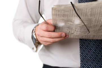Closeup of a Businessman Reading Newspaper